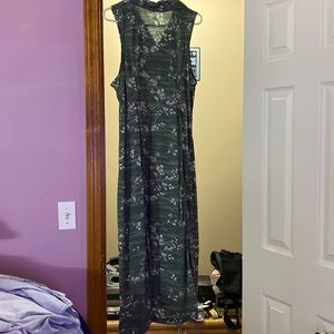 Flowered green long dress.    Sleeveless and has buttons in the front.